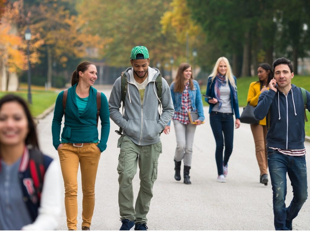 students-walking-on-campus - Higher Education Today