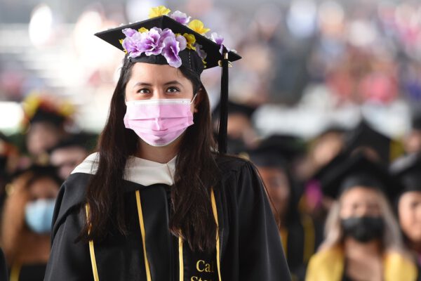 Student in a pink mask at California State commencement
