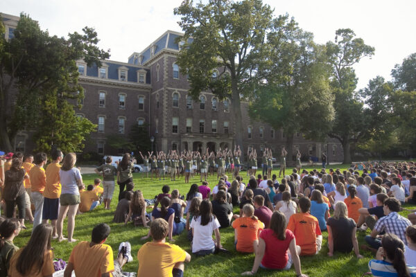 New student orientation at Lafayette College. Students are gathered on the quad and a group of them are leading an activity.
